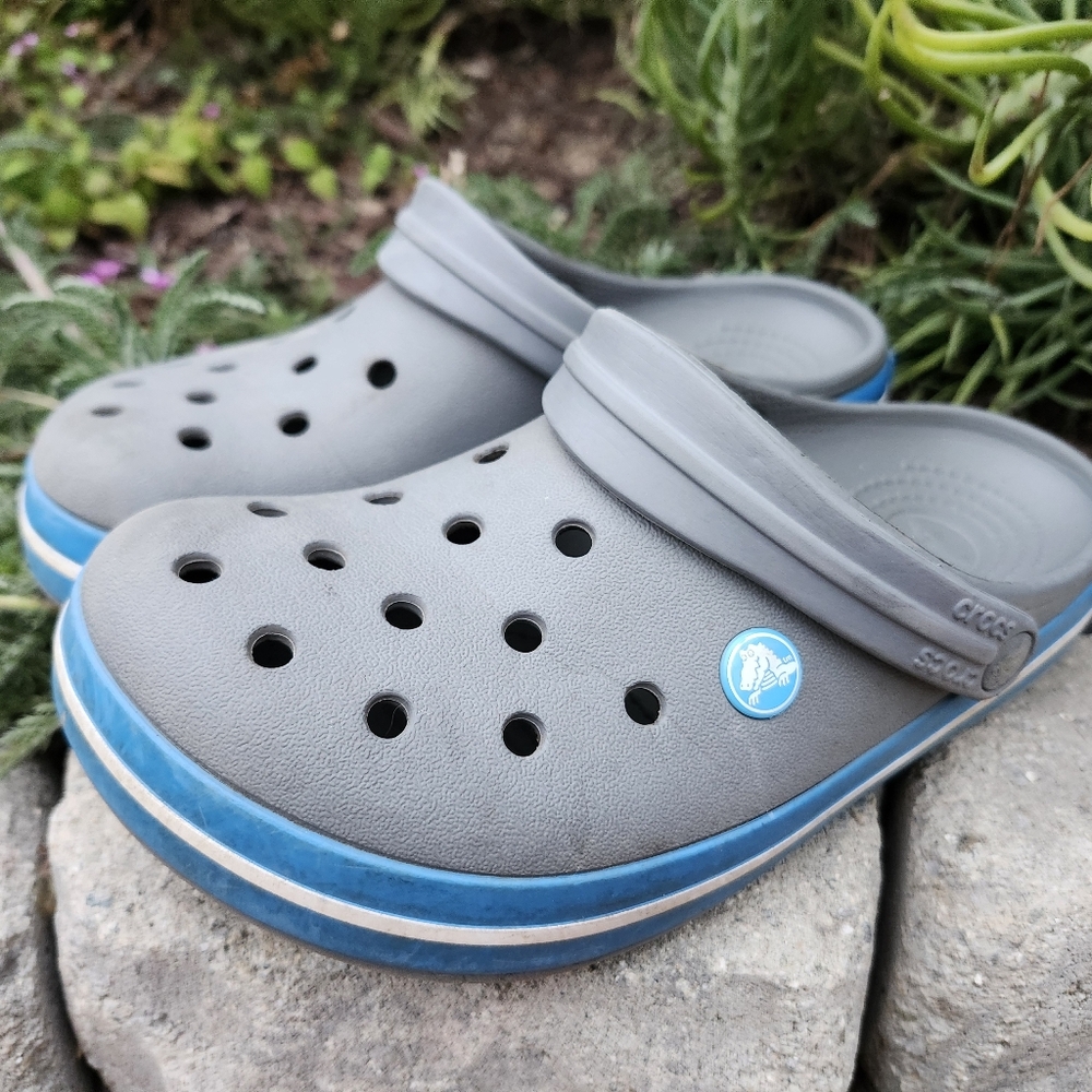 Crocs, size 6 mens/ 8 womens, grey with blue stripe, used